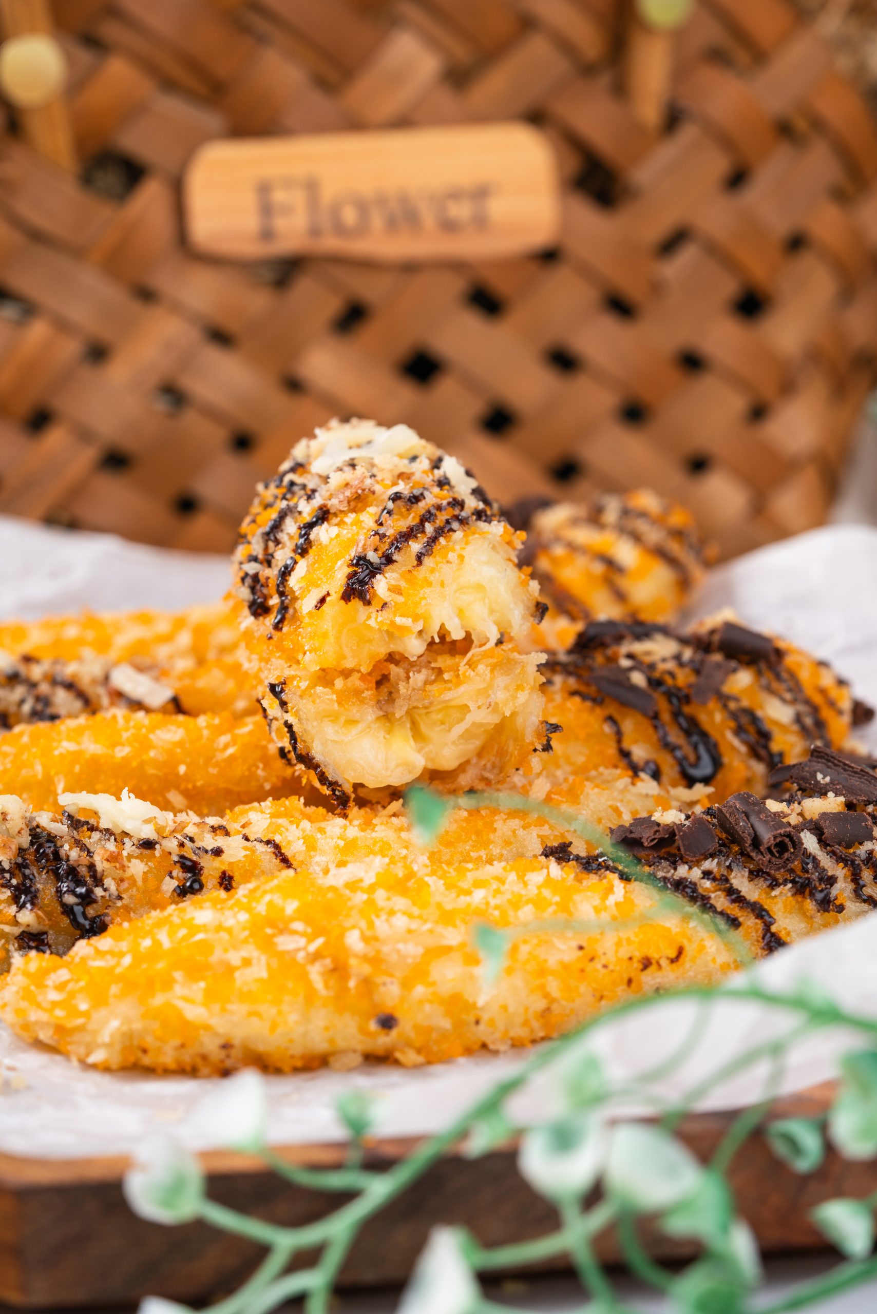 Zoomed-in banana fritter showing layers of crispy crust and soft banana filling