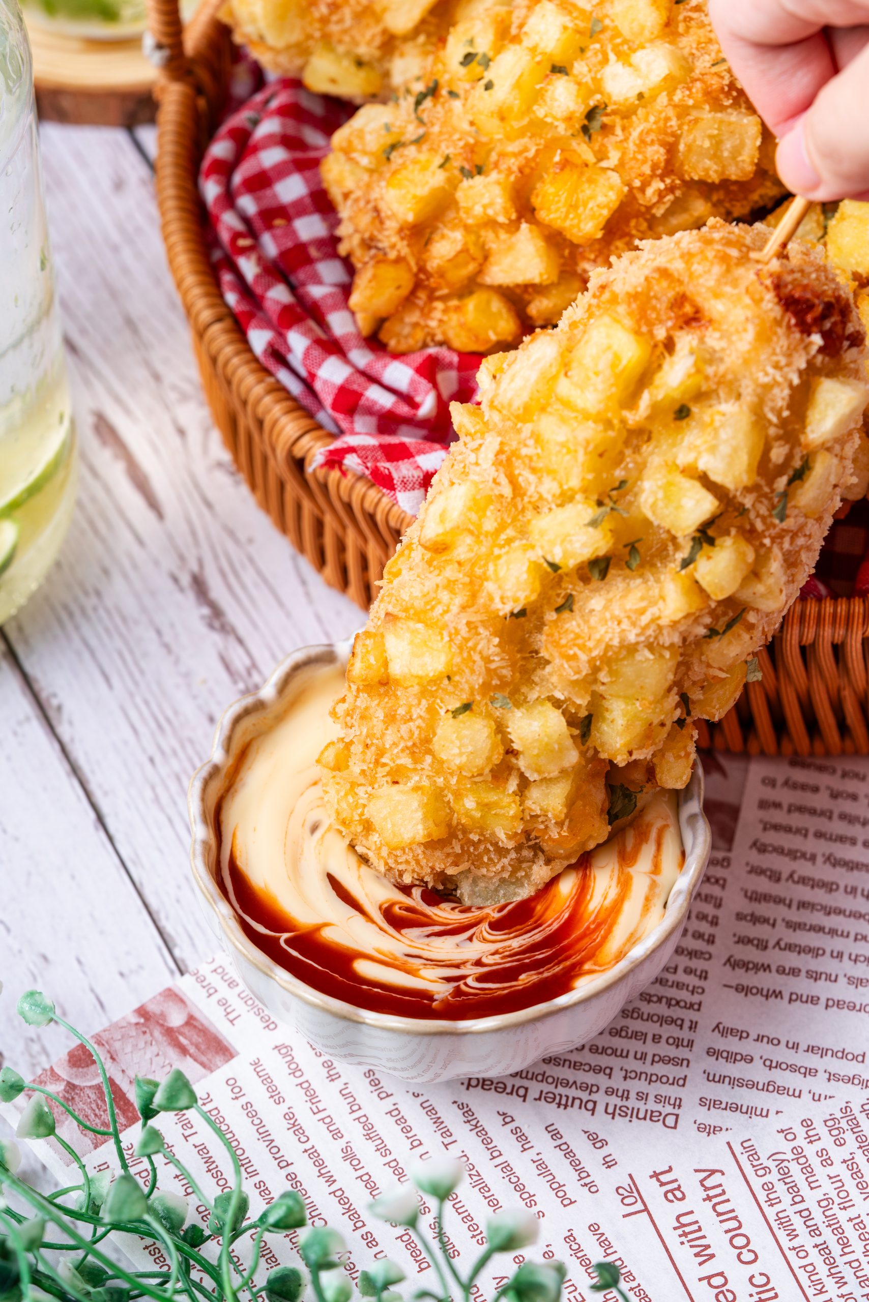 Crispy Korean potato corn dog dipped in creamy sauce, golden fried batter with diced potato crust.